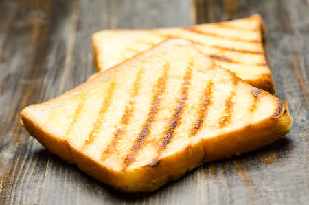 The toast on wooden background,breakfast or mealの写真素材