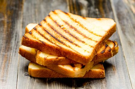 Toast on wooden background,breakfast or mealの写真素材