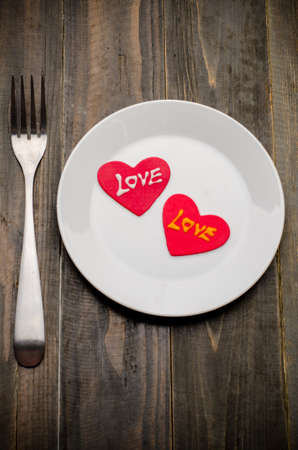 Red heart shape with love on white dish,Valentine day,love conceptの写真素材