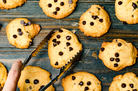 Selection of homemade chocolate chip cookies on wooden backgroundの写真素材