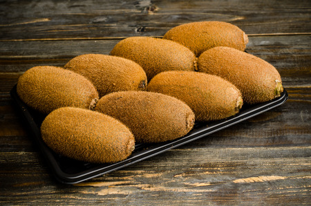 Fresh kiwi fruit on wooden backgroundの写真素材