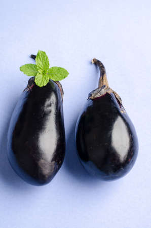 Eggplant on blue pastel color  backgroundの写真素材