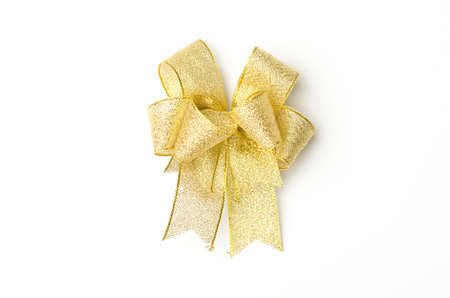 Golden ribbon for decoration(Christmas,new year or Valentine day) on white backgroundの写真素材
