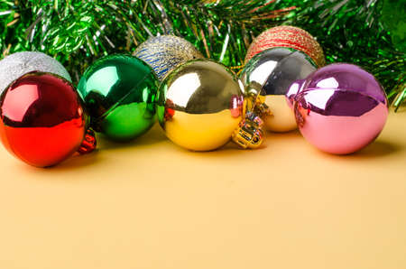 Colorful christmas ball for decoration on yellow backgroundの写真素材