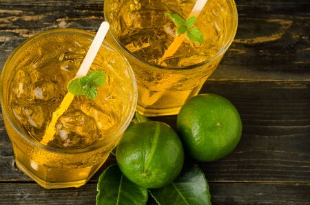 Ice lemon tea on wooden background