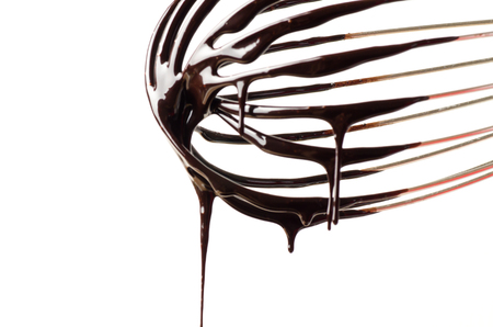 Wire whisk with chocolate sauce,cooking bakeryの写真素材