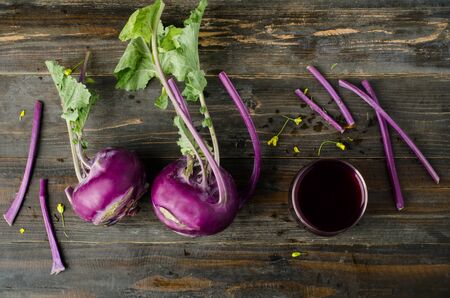 Purple kohlrabi on wooden backgroundの写真素材