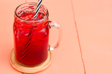 Ice red drink in the glass