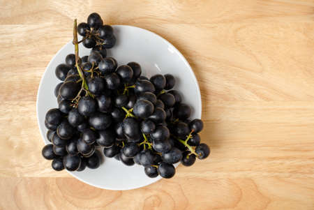 Seedless grape on wooden backgroundの写真素材