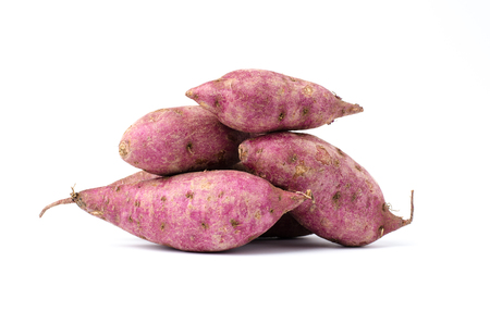 Raw sweet potatoes on white backgroundの写真素材
