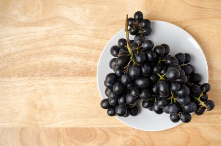 Seedless grape on wooden backgroundの写真素材