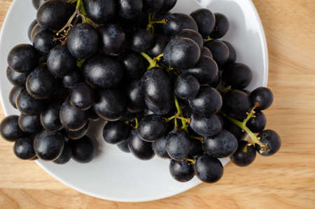 Seedless grape on wooden backgroundの写真素材