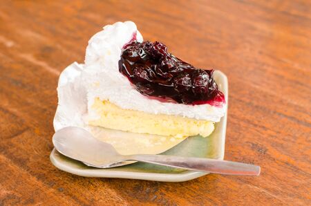 Slice of blueberry cheesecake on plate
