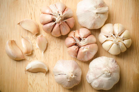 Fresh garlic on wooden background,food ingredientの写真素材