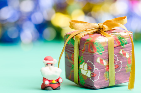 Gift box and santa claus doll in Christmas dayの写真素材