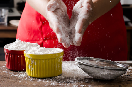 Sifting wheat flour into the bowl,food ingredient,prepare for cooking or bakingの写真素材