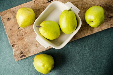 Fresh pears fruit on wooden and green background,healthy foodの写真素材
