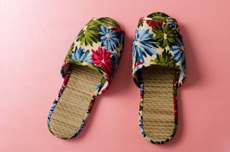 Colorful shoes on pink backgroundの写真素材