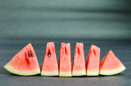 Sliced watermelon on green background,tropical fruitの写真素材
