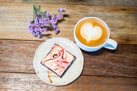Sliced brownie and latte coffee in the morningの写真素材