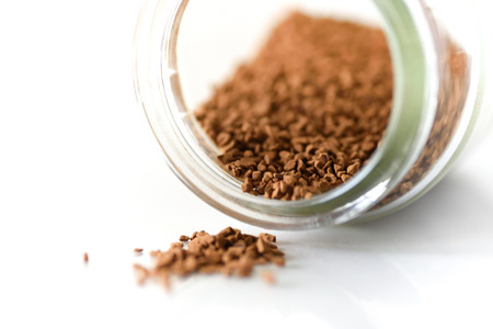 Instant coffee in a jar on white backgroundの写真素材
