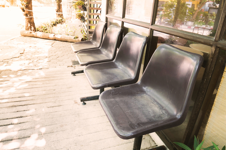 Empty waiting chair outside the shopの写真素材