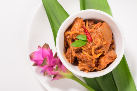 Northern Thai food (Kaeng Hang Le),spicy curry pork mixed with spices in a bowl.Top view of foodの写真素材