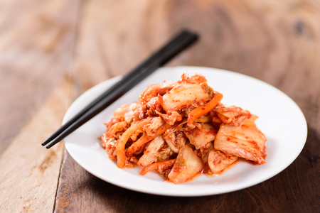 Korean food, kimchi cabbage on white dish with chopsticks for eating.Healthy foodの写真素材