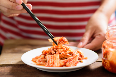 Korean food, kimchi cabbage on white dish with chopsticks for eating.Healthy foodの写真素材