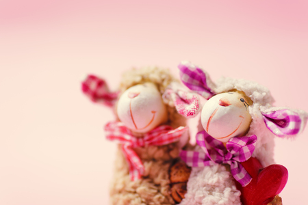 Decoration couple doll with red heart on pink background, valentine day conceptの写真素材