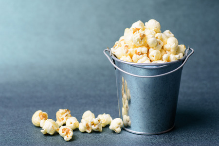 Caramel popcorn in a bucket, delicious snackの写真素材
