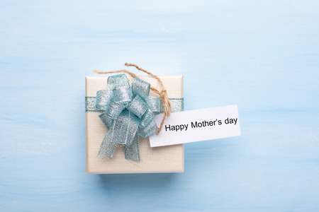 Gift box with Happy Mother's day tag card for giving in mother's dayの写真素材