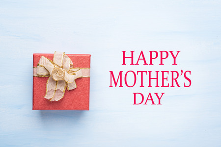Red gift box with Happy Mother's day text, present for giving in Mother's day