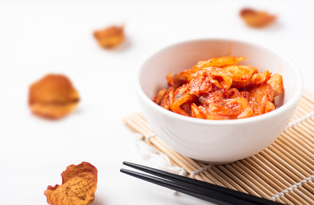Kimchi cabbage in a bowl with chopsticks, Korean foodの写真素材