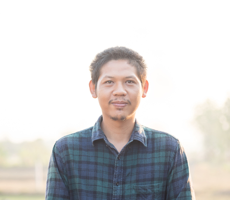 Portrait of Asian man (Thai man) in outdoor