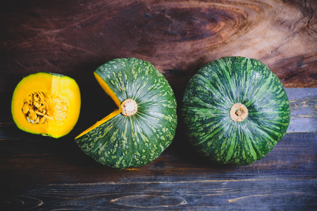 Green pumpkins on wooden background, organic vegetableの写真素材