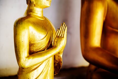 Close up hand of buddha statue in the templeの写真素材