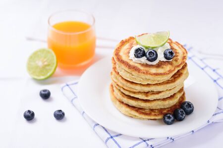 Oatmeal pancake with blueberry and orange juiceの写真素材