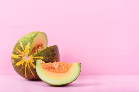 Thai cantaloupe on pink pastel background with copy spaceの写真素材