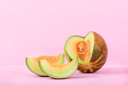 Thai cantaloupe on pink pastel background with copy spaceの写真素材