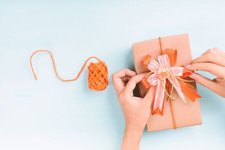 Gift box wrapped with paper and decoration with ribbon, handmade present for givingの写真素材