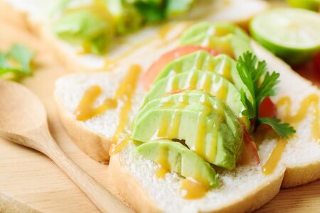 Bread and slice avocado with caramelの写真素材