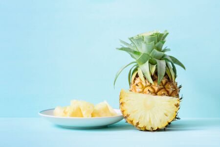 Ripe pineapple on pastel color background, tropical fruitの写真素材