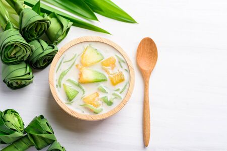 Thai dessert (Lod Chong), rice flour pandan flavor and sliced melon fruit in coconut milkの写真素材