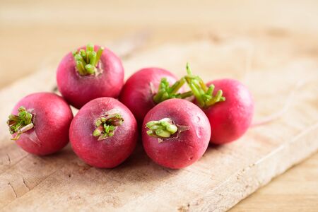 Fresh radish on wooden background, organic vegetable