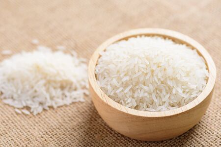 Organic Thai Jasmine rice grain in a bowl preparing for cookedの写真素材