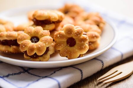 Cracker with pineapple jam (flower shape) on plate ready to eating, Thai snackの写真素材