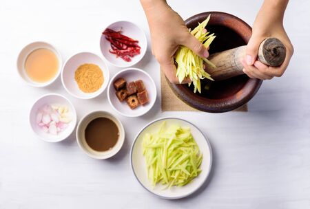 Thai food cooking, spicy green mango salad (Tum Ma Muang), Top viewの写真素材