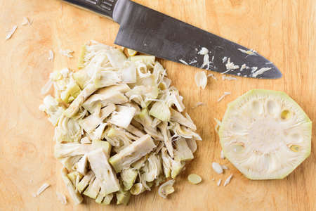 Asian food cooking, sliced young jackfruit on wooden cutting board, Top view
