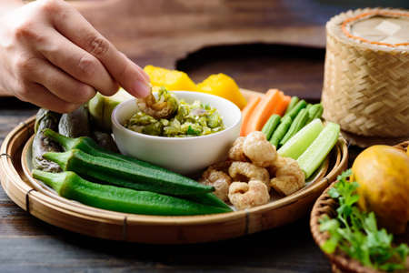 Northern Thai food (Nam Prik Num), Spicy young green chili dip eating with boiled vegetables, fresh...
